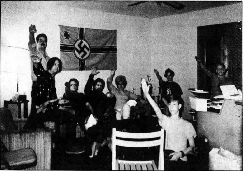 Photo confiscated by FBI from Jonathan David Brown's residence. Brown is seated at left.